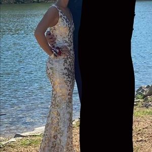 gold and white prom dress. size zero, very stretchy, not itchy.